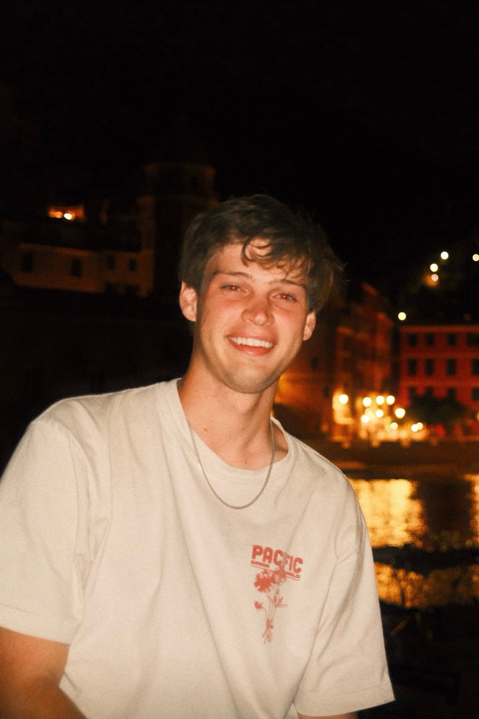 Jackson Mock at night by a harbor